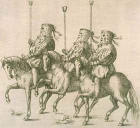 Drei maskierte Reiter auf drei Pferden